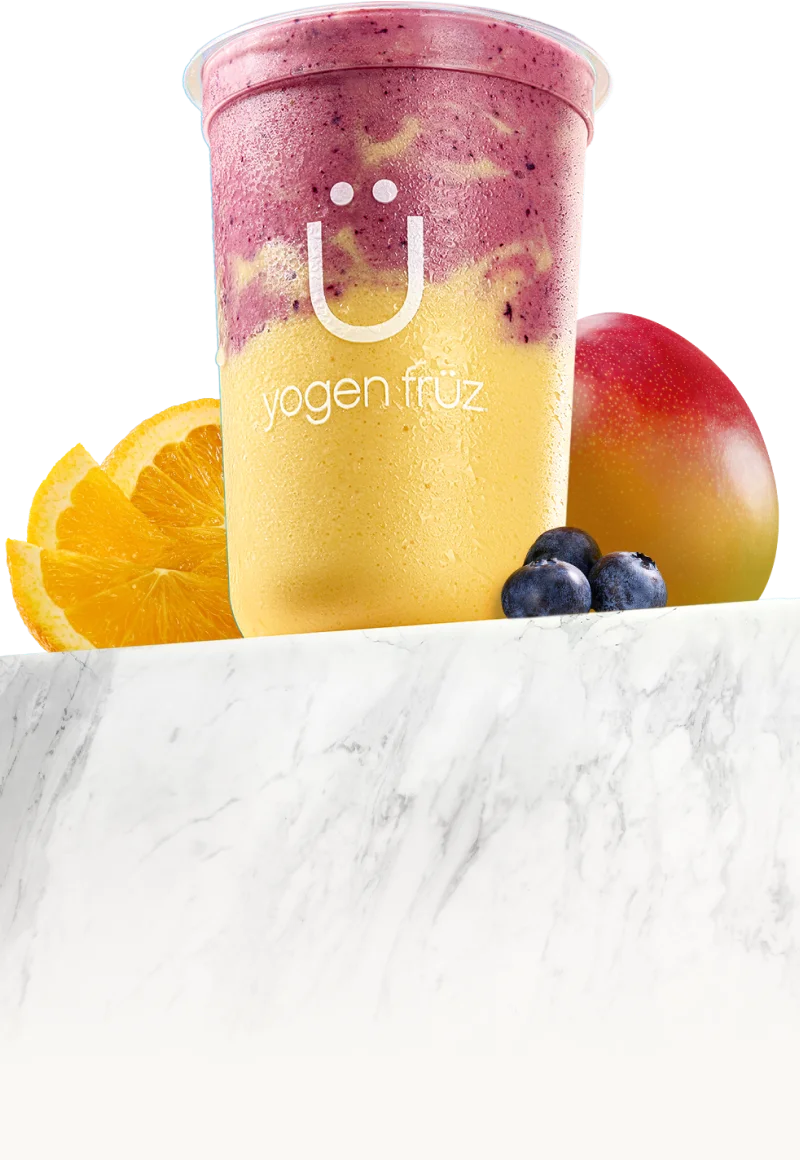 Power Smoothie: a layered mango and mixed berry smoothie with fresh fruit